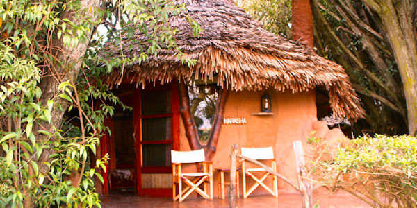 Chui Lodge de cottages liggen verspreid door de inheemse tuin met een magnifiek uitzicht. Naivasha Meer in Kenia