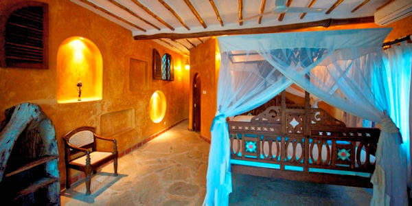 Waterlovers Beach Resort suite interieur slaapkamer, Diani Beach in Kenia